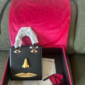 Black and Gold Designer Face Motif Handbag